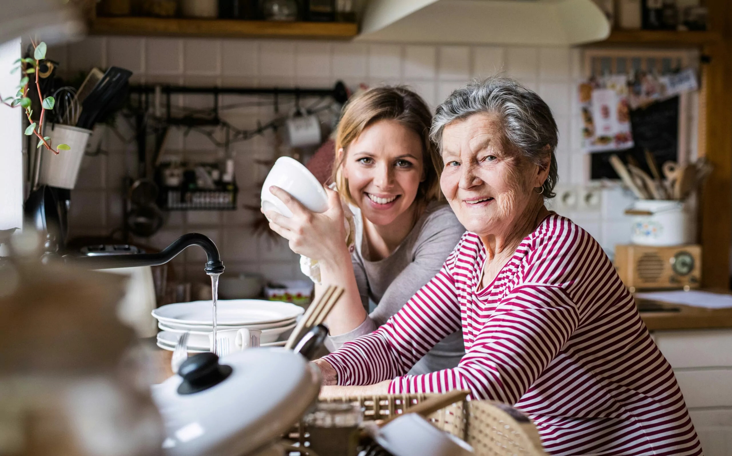 Two women washing dishes